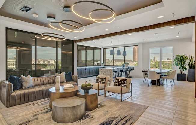 A modern living room with a large window and a view of the city.