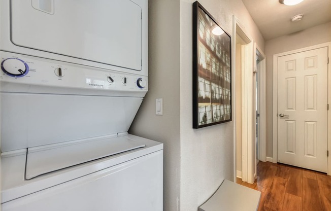 Washer Dryer with Wood Inspired Floor, White Doors, Ceiling Lights