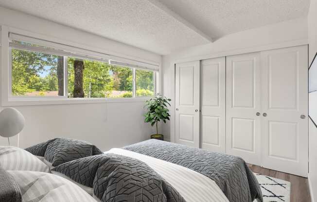 Bedroom with two beds and a window at Larkspur West Linn, West Linn, OR, 97068