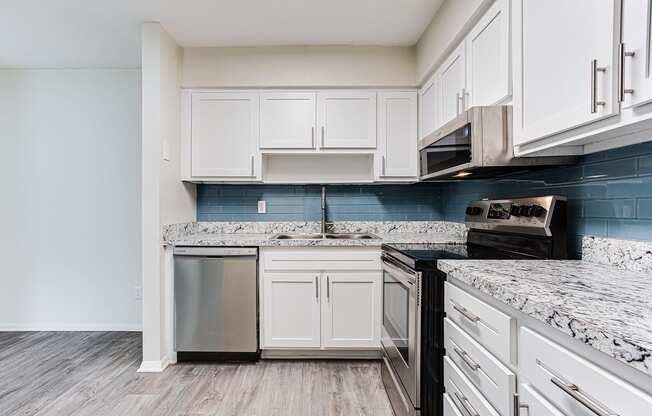 Kitchen with appliances and cabinets1 at Parks At Utoy Creek, Atlanta, GA, 30331