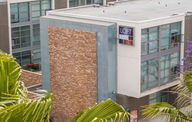 A building with a sign that says "LOFT 2015" on it.