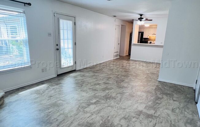 Charming 2 bedroom 1-bathroom Duplex unit features a prime location