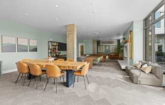 a dining room with a wooden table and chairs