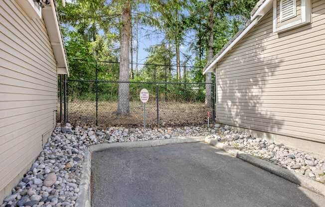 A car wash area with trees behind it at Abbey Rowe Apartments in Olympia, WA