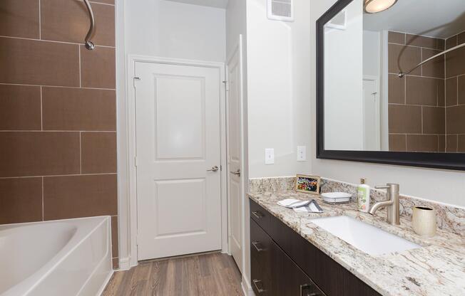 a kitchen with a sink and a mirror