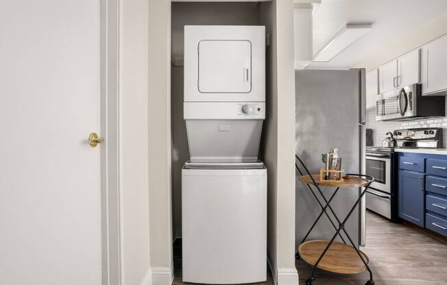 a small washer and dryer in a kitchen
