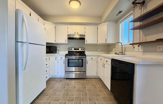 OCTOBER IS FREE!! 3-Bedroom Townhome with 2-Car Garage, Fenced Yard & In-Unit Laundry!