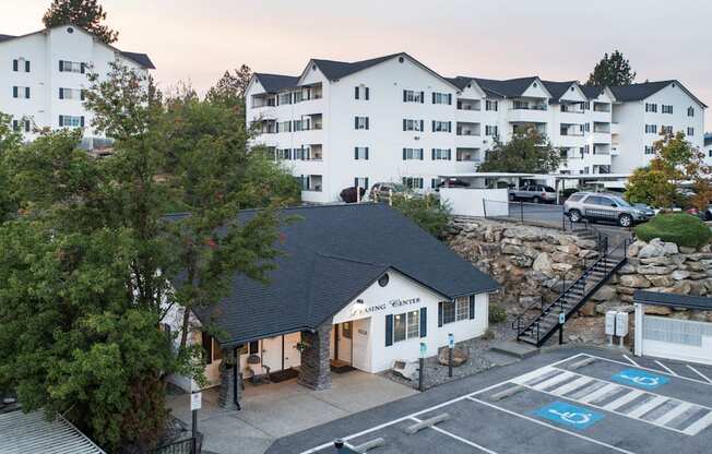 A parking lot with a building in the background.