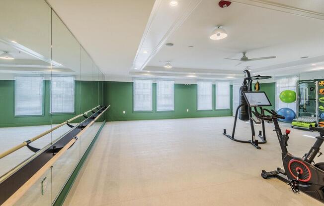 Spacious yoga and barre studio with spin bikes at The Merchant Apartments, South Carolina