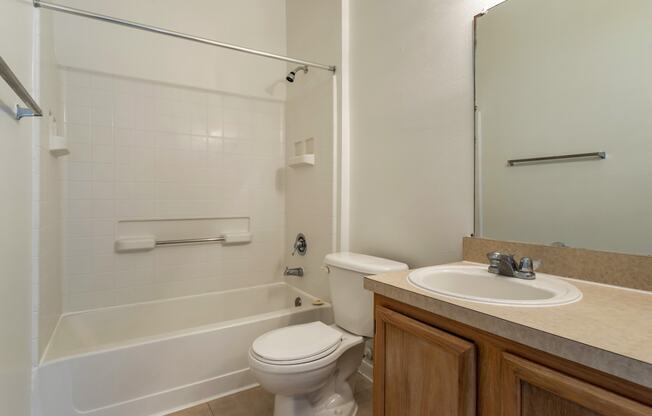 a bathroom with a sink toilet and a shower