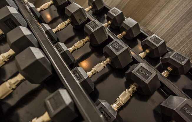 a row of weights on a gym machine