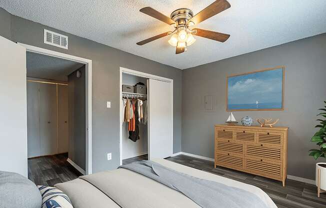 large bedroom with wood-style flooring and large closet