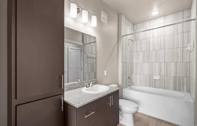 a bathroom with a sink toilet and a shower