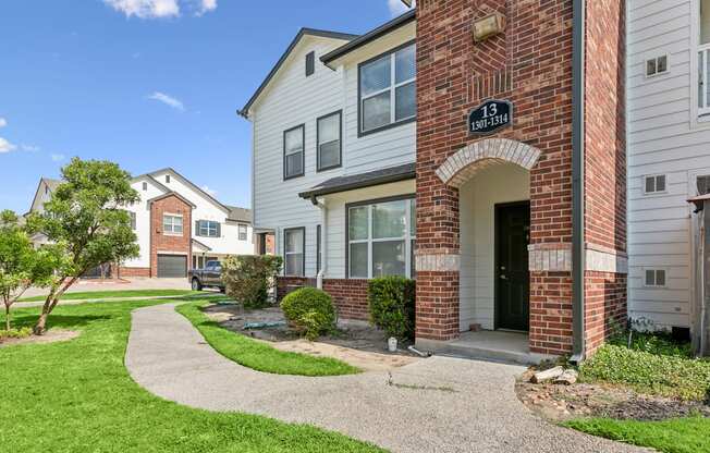 A brick building with a sign that says "1234" on it.