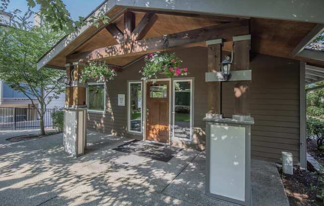 A shaded walkway leading up to the entrance of the renovated leasing office at Foster Creek apartments