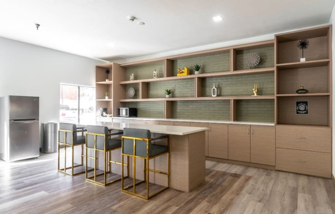 a kitchen with a table and chairs in front of a counter