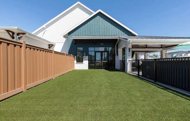 large fenced bark park with lush green grass at Lake Nona Concorde