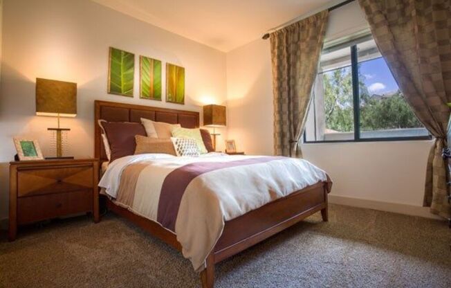 a bedroom with a bed and a large window at Canyon Crossroads in Phoenix, AZ 85085