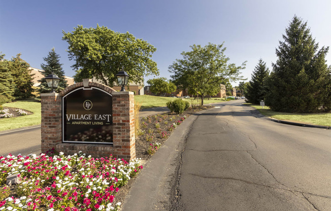 This is a photo of the entrance sign at Village East Apartments in Franklin, OH.