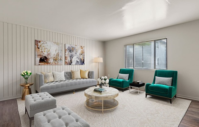 A living room with a grey sofa, green armchairs, and a coffee table.