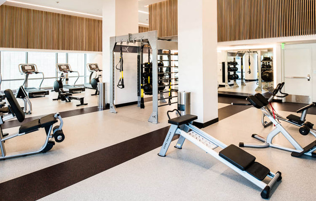 a gym with a lot of exercise equipment