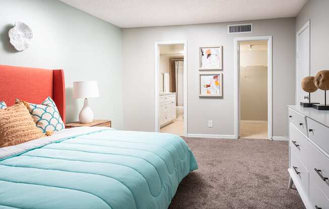 a bedroom with a bed and a closet at Fairways of Inverrary, Florida