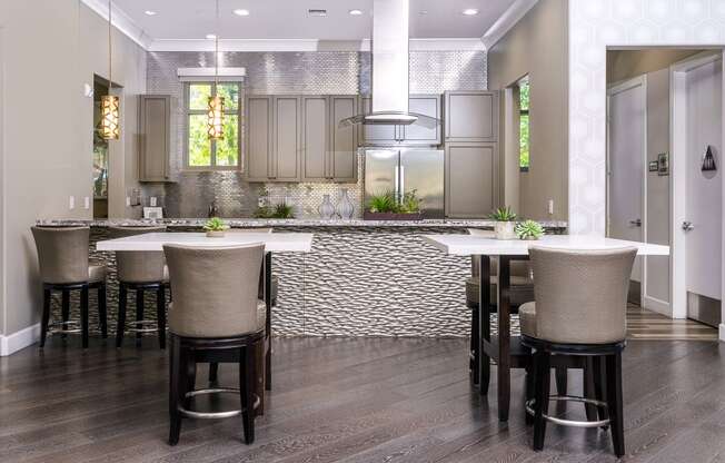 a kitchen with a large center island with a white countertop