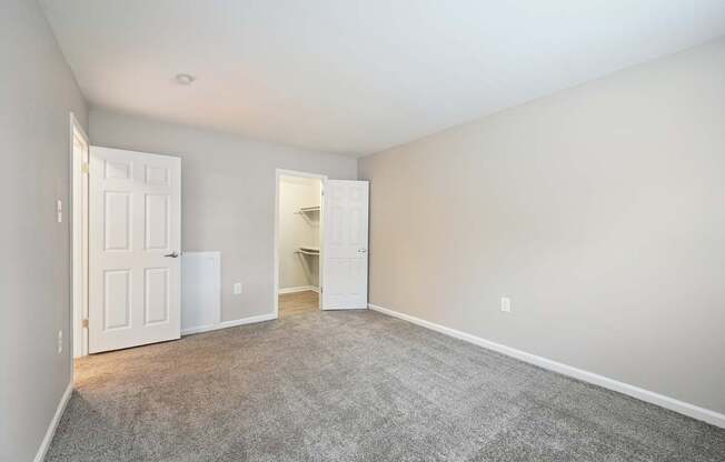 An empty bedroom with white door at ReNew Odenton