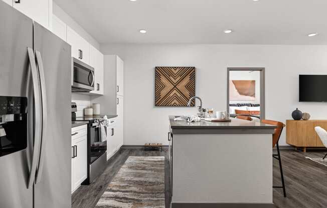 a kitchen with stainless steel appliances and a counter top