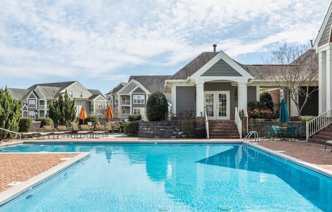 Resort-style pool with view of Durham, North Carolina apartment community