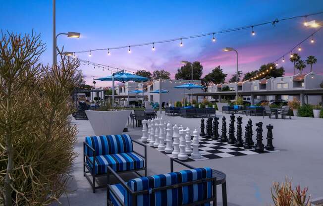 a giant chess board is set up on a patio