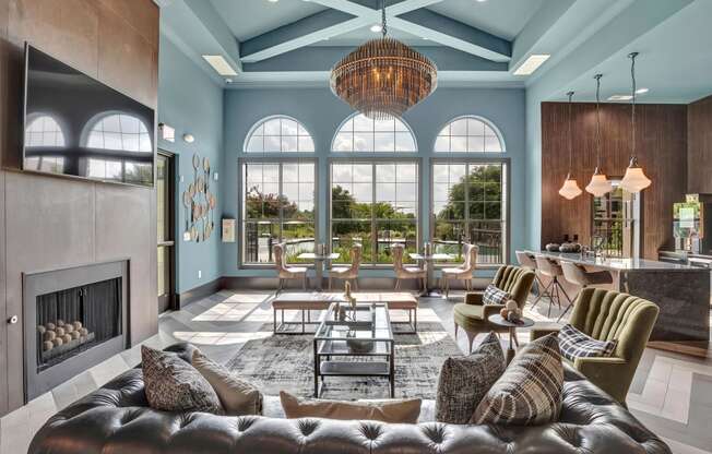 a living room filled with furniture and a large window