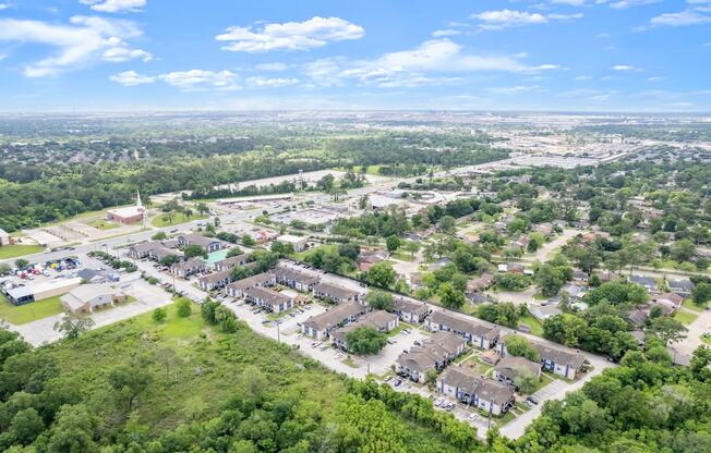 an aerial view of a neighborhood with houses and trees