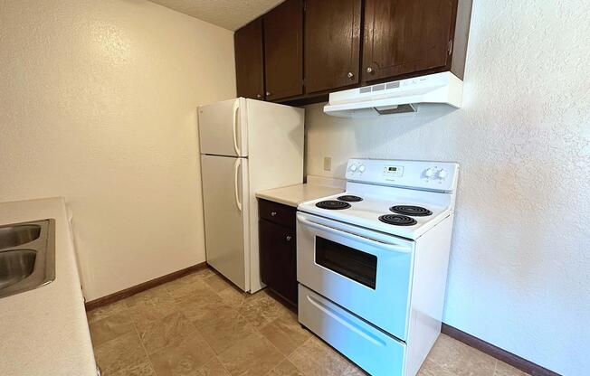 a kitchen with a stove top oven sitting inside of a refrigerator