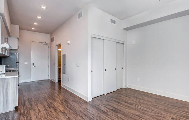 A room with wooden floors and white walls.