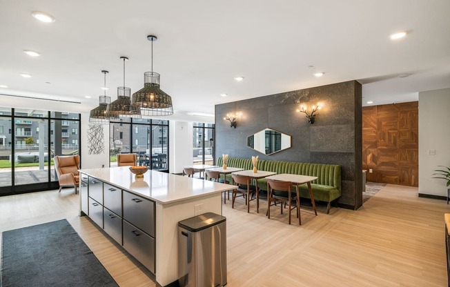 a communal kitchen and dining area with a table and chairs at EagleRidge Plaza Residences, Fargo, 58104