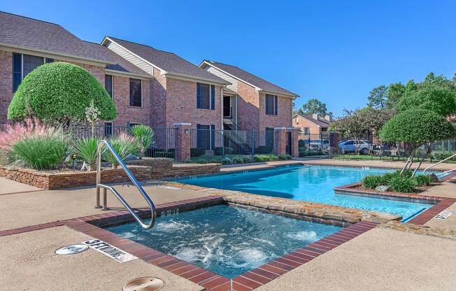 a house with a pool in front of a building