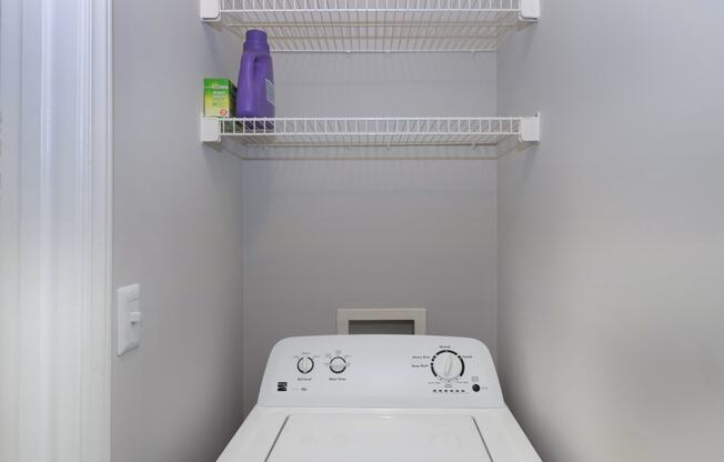 a laundry room with a washer and dryer