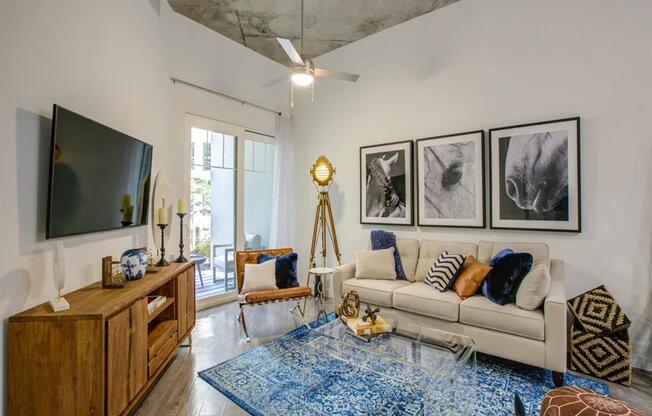 a living room filled with furniture and a flat screen tv at Altis Grand Central, Florida