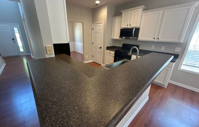 4 Bedroom | 3 Bathroom Apex Home with Fenced Backyard