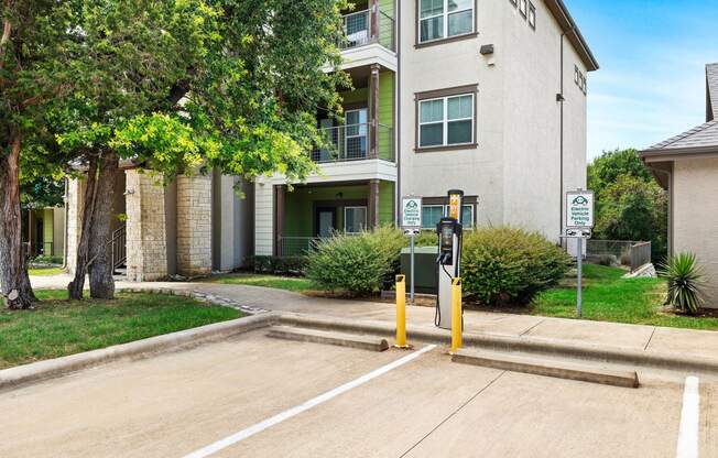 a parking meter in front of an apartment building