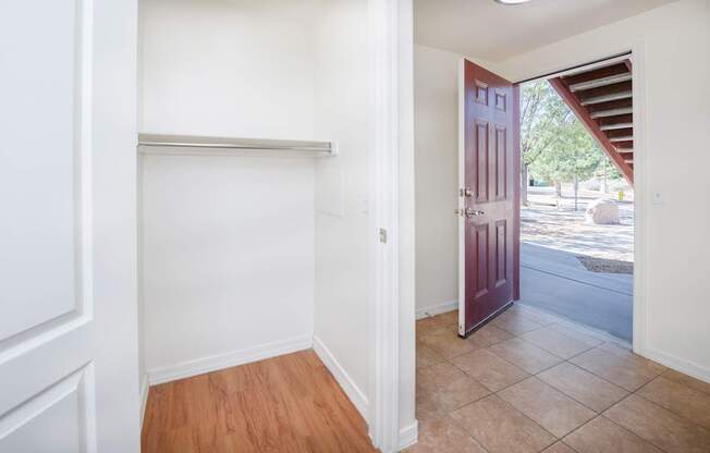 A room with a white door and a red door.
