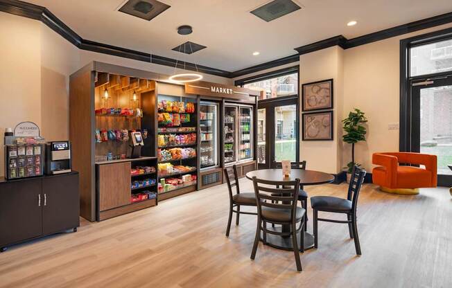 A modern kitchen with a wooden floor and a dining table with chairs.