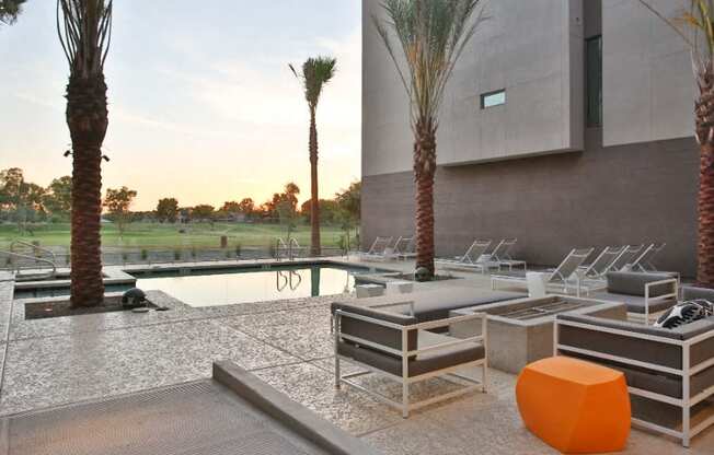 Apartments in Scottsdale-Dusk Scottsdale Swimming Pool with Lounge Chairs, a Fire Pit, and Amazing Views