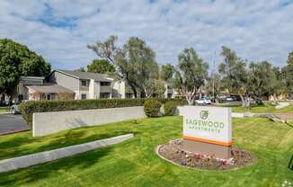 the sign for sagwood park at the entrance of the community