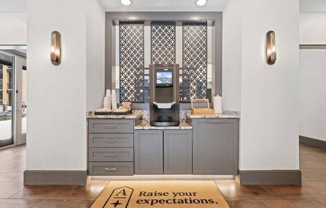 A reception area with a sign that says Raise your expectations.