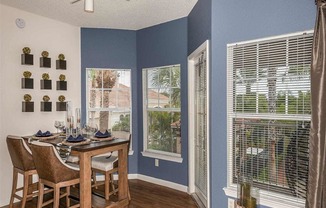 Dining room with table and windows looking out