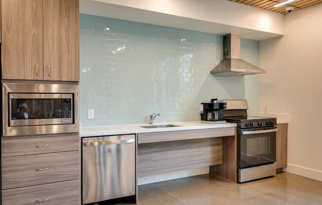 a kitchen with stainless steel appliances and a sink