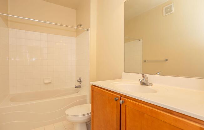 a room with a sink and a mirror
