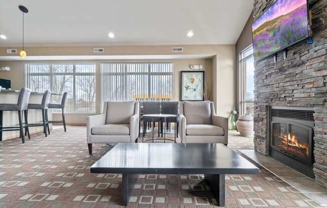 the preserve at ballantyne commons living room with fireplace and table